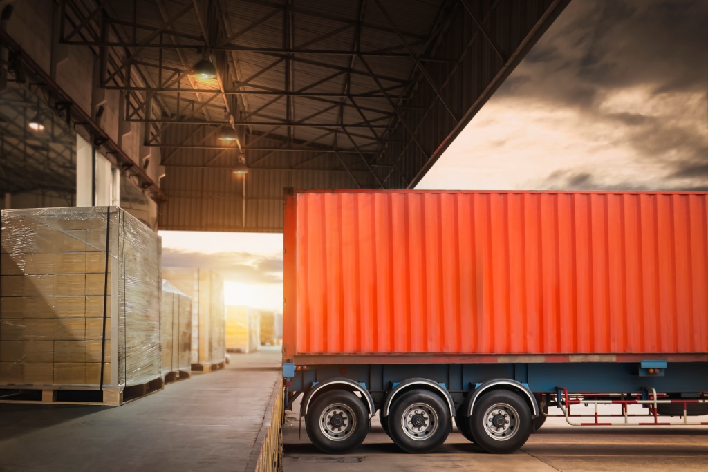 Container Trailer Trucks Parked Loading at Dock Warehouse. Delivery Truck. Package Boxes Shipment. Distribution Warehouse. Supply Chain. Freight Trucks Logistics Cargo Transport