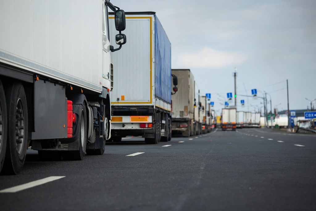 a Long Traffic Jam Of Many Trucks At The Border