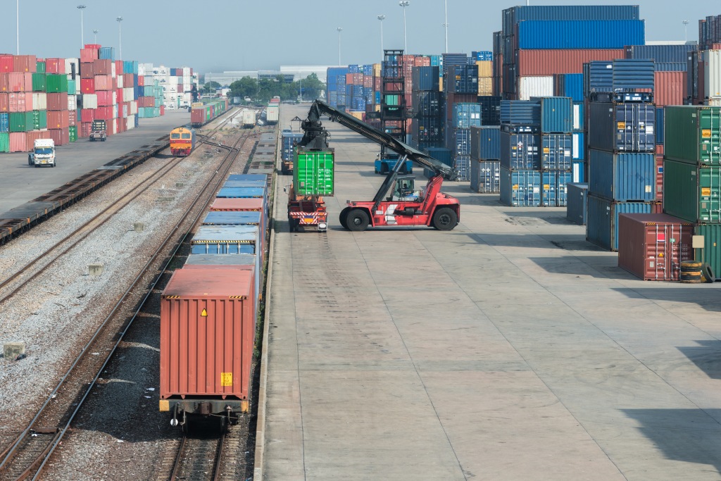 Cargo train platform with freight train container at depot in port use for export logistics background.