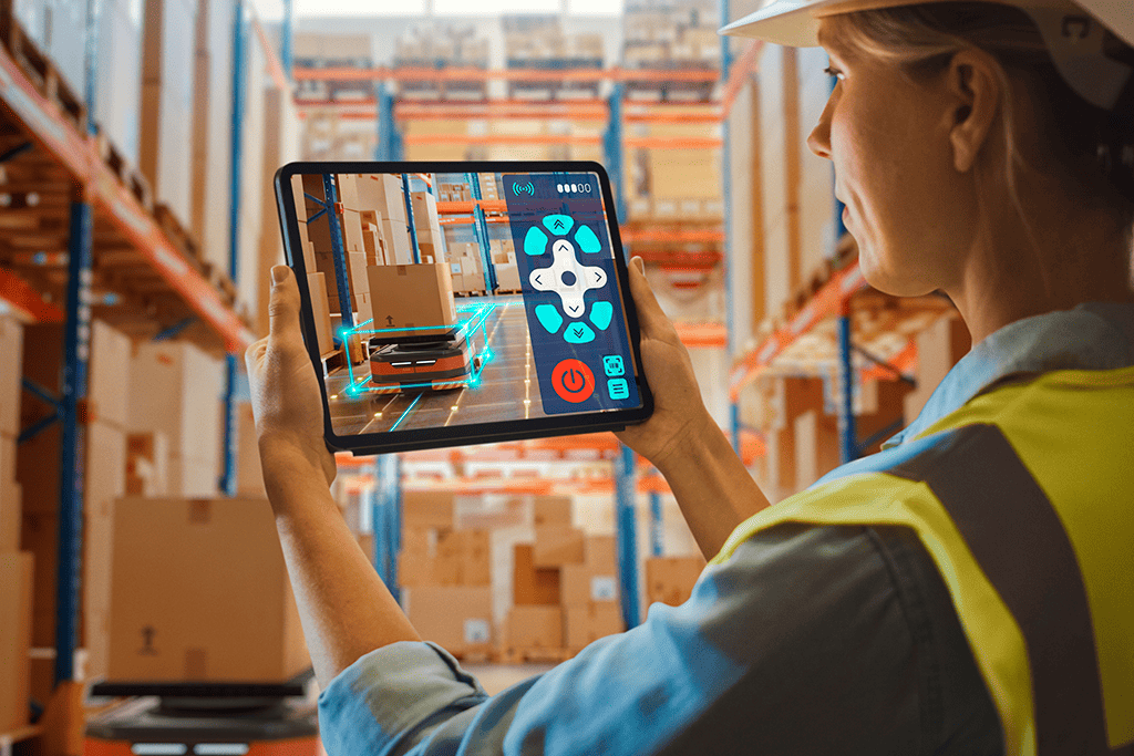 Woman worker using tablet for technology logistics automation at storage. 